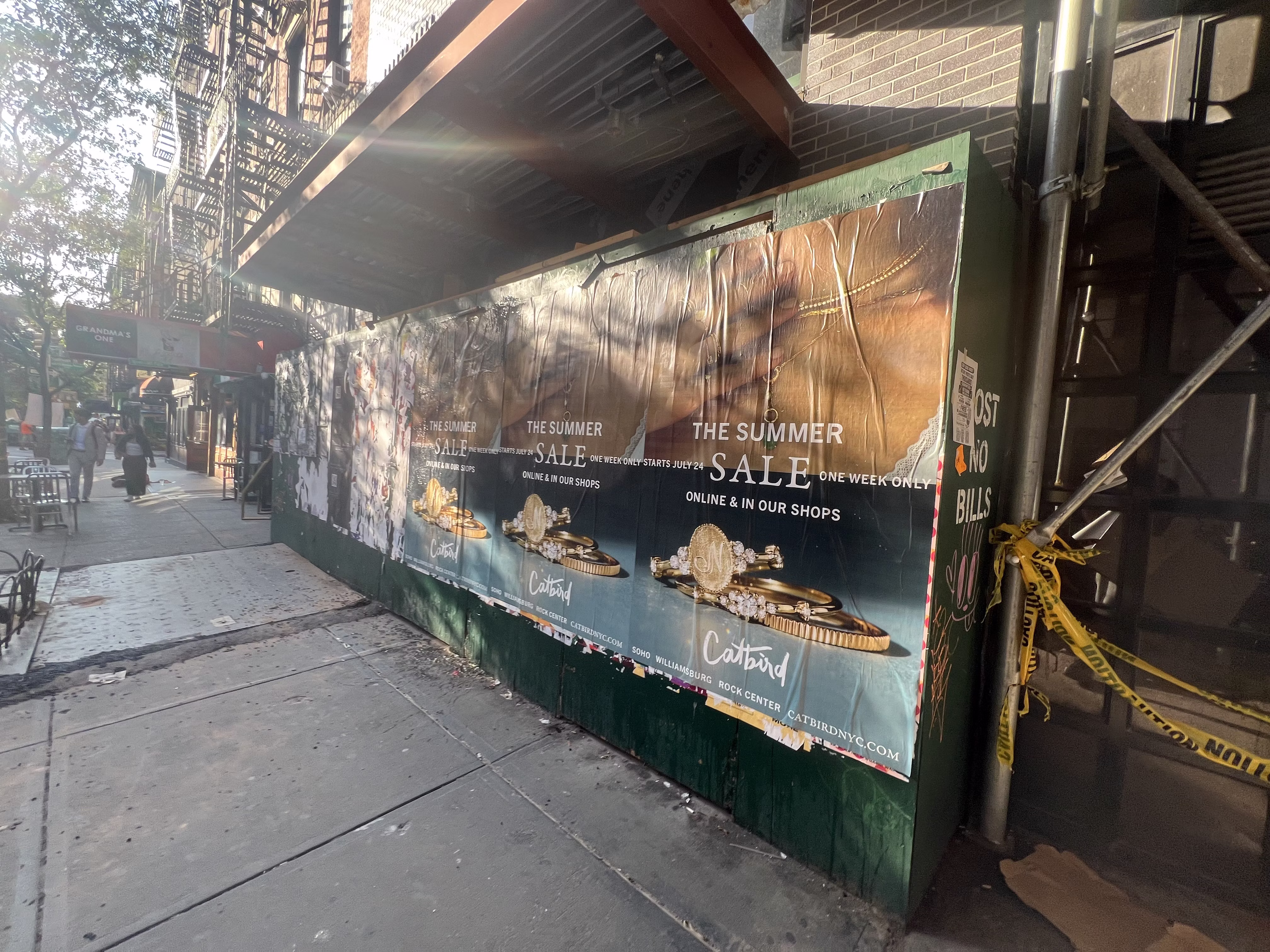 Catbird Summer Sale wild posting at 160 Bleecker St